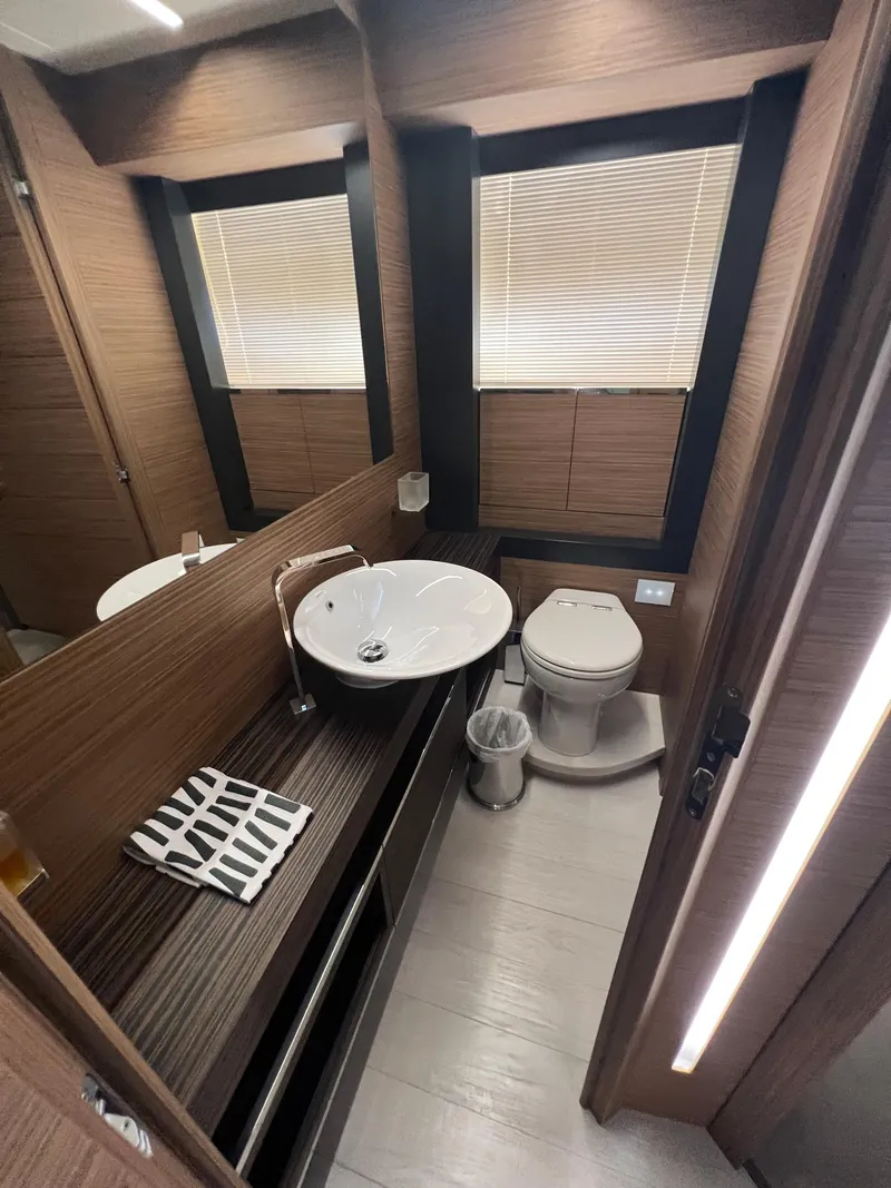 Slide: The Image of Luxury bathroom in 2017 Pershing 92 Motor Yacht with modern fixtures and elegant design. - 45