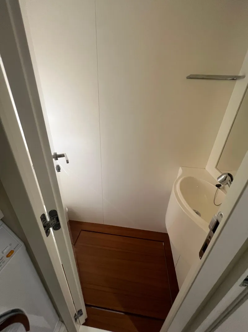 Slide: The Image of Compact bathroom in 2017 Pershing 92 Motor Yacht with wooden flooring and modern fixtures. - 49