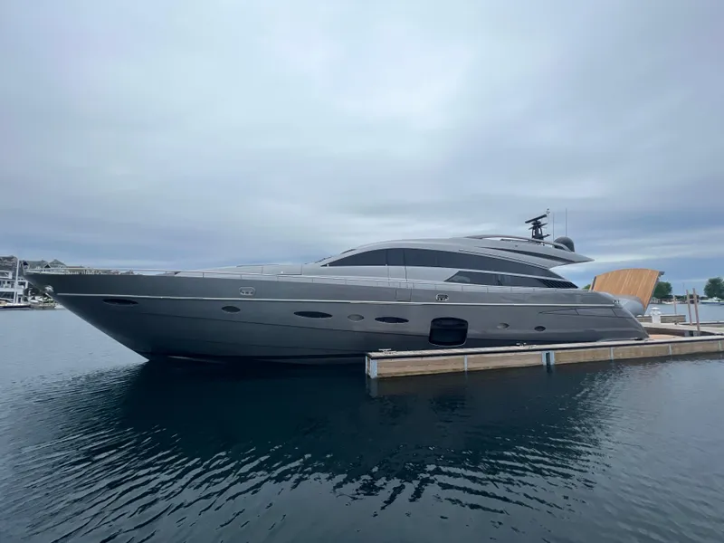 Slide: The Image of 2017 Pershing 92 Motor Yacht docked on calm water under cloudy skies. - 7