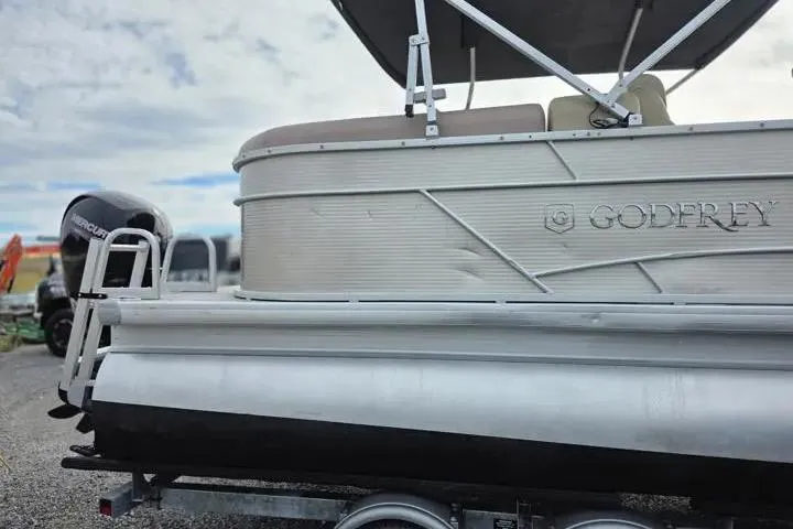 Slide: The Image of 2021 Godfrey Sweetwater 2086 BF pontoon boat with Mercury engine, side view. - 6