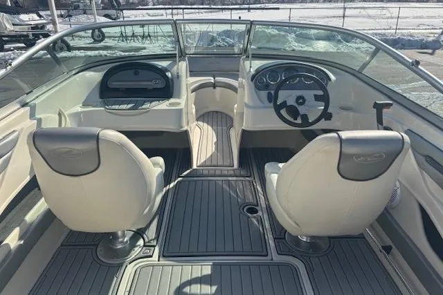 Slide: The Image of 2008 Sea Ray 205 Sport boat interior with dual seats and steering wheel. - 7