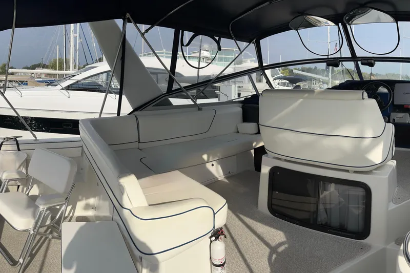 Slide: The Image of Luxurious interior of 1990 Carver 528 Montego yacht with white seating and modern design. - 5