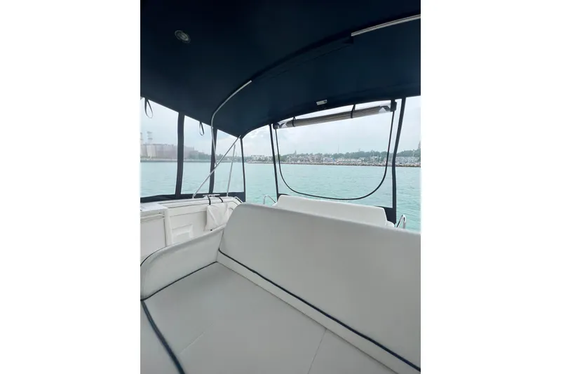 Slide: The Image of Interior view of 1990 Carver 528 Montego boat with waterfront scenery. - 7