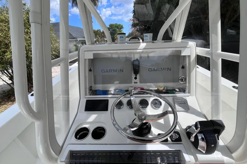 Slide: The Image of 2021 SeaVee 340B Open boat console with Garmin navigation system and steering wheel. - 21