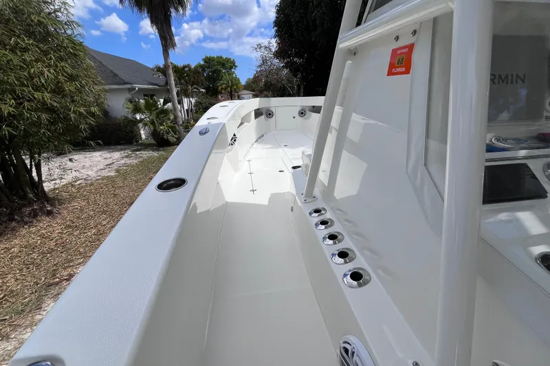 Slide: The Image of 2021 SeaVee 340B Open boat deck, showcasing sleek design and rod holders. - 23