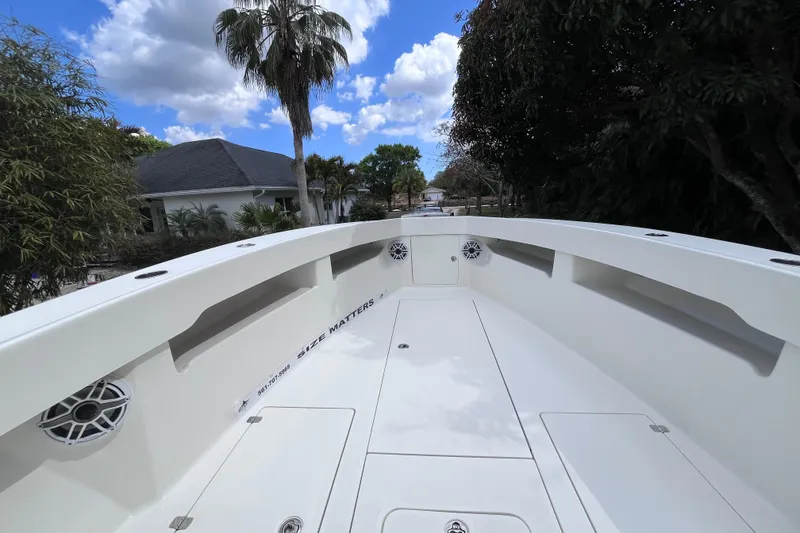 Slide: The Image of 2021 SeaVee 340B Open boat deck with clear sky and palm trees. - 25