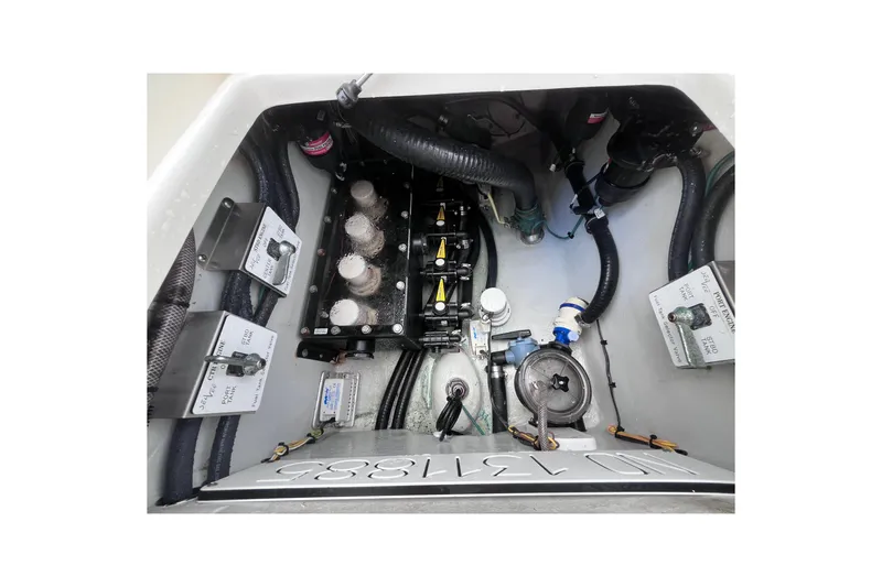 Slide: The Image of 2021 SeaVee 340B Open boat engine compartment with various mechanical components and wiring. - 37