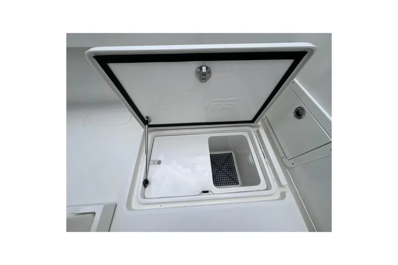 Slide: The Image of 2021 SeaVee 340B Open boat storage compartment with open lid, showcasing interior space. - 38