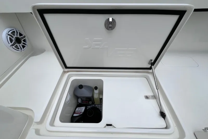 Slide: The Image of 2021 SeaVee 340B Open storage compartment with maintenance supplies and speaker. - 39