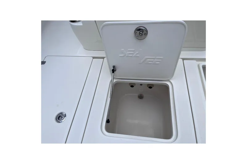Slide: The Image of 2021 SeaVee 340B Open boat storage compartment with open lid. - 45