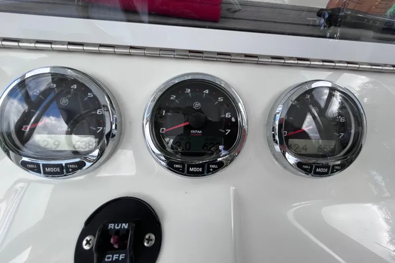 Slide: The Image of Dashboard of 2021 SeaVee 340B Open boat showing RPM gauges and controls. - 51