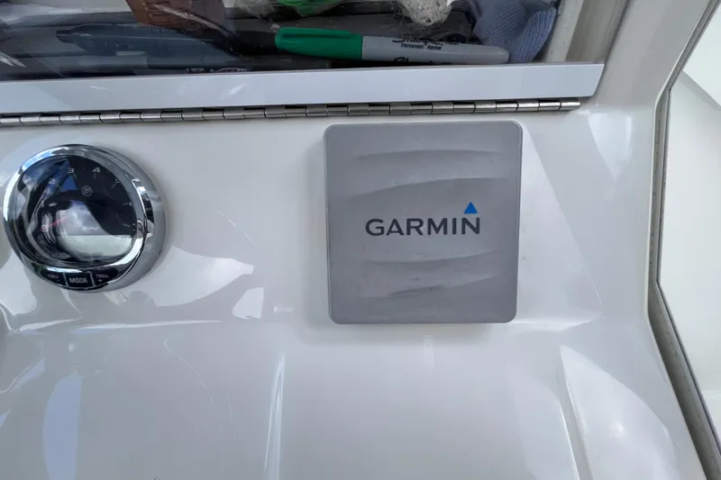 Slide: The Image of Garmin device on 2021 SeaVee 340B Open boat dashboard with RPM gauge. - 54