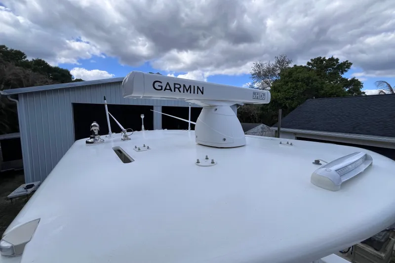 Slide: The Image of 2021 SeaVee 340B Open boat with Garmin xHD2 radar under cloudy sky. - 57