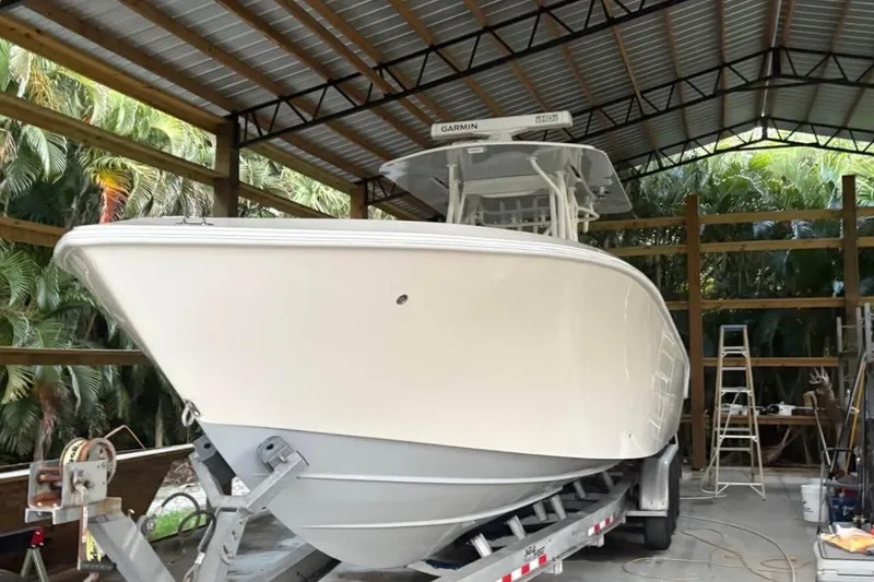 Slide: The Image of 2021 SeaVee 340B Open boat on trailer in covered storage area. - 6