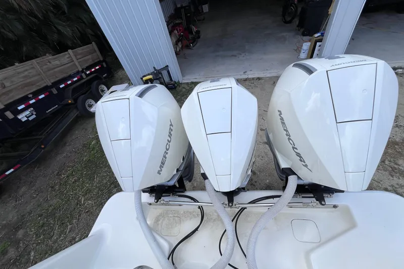 Slide: The Image of Triple Mercury outboard engines on a 2021 SeaVee 340B Open boat. - 61