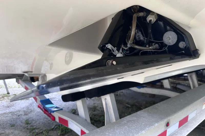 Slide: The Image of 2021 SeaVee 340B Open boat on trailer, showing trim tab and hydraulic components. - 63