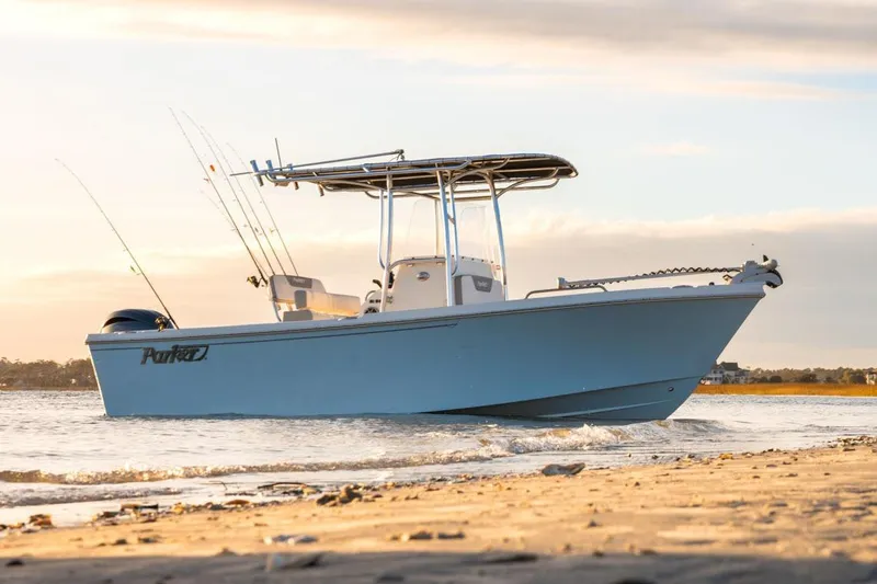 Slide: The Image of Manufacturer Provided Image: 2026 Parker 210 Coastal boat on water at sunset, equipped with fishing rods. - 3