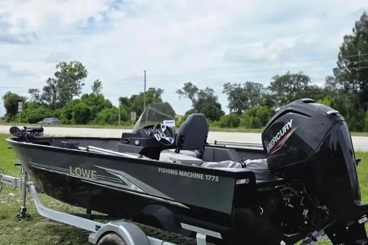 Slide: The Image of 2021 Lowe Fishing Machine 1775SC boat with Mercury engine on trailer. - 20