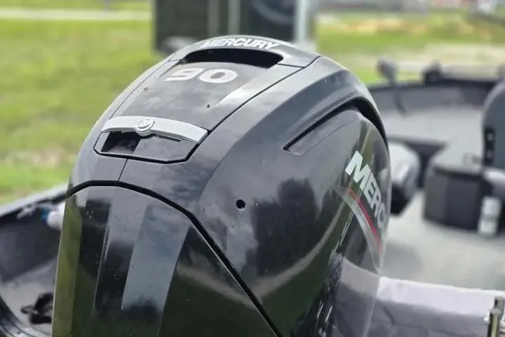 Slide: The Image of 2021 Lowe Fishing Machine 1775SC with Mercury 90 outboard motor, close-up view. - 22