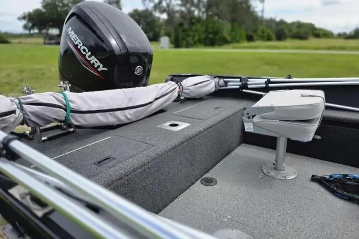 Slide: The Image of 2021 Lowe Fishing Machine 1775SC boat with Mercury engine, featuring a swivel seat. - 31