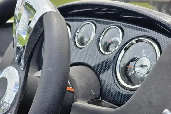 Slide: The Image of Dashboard of 2021 Lowe Fishing Machine 1775SC with steering wheel and gauges. - 37