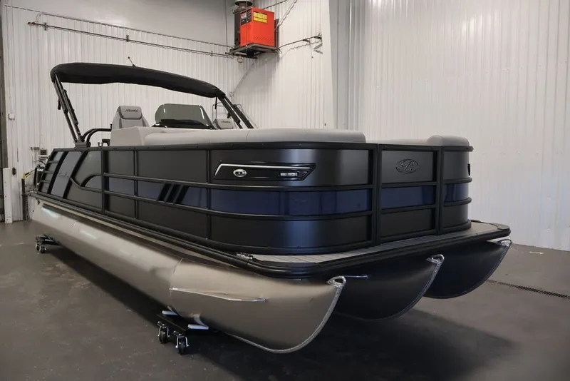 Slide: The Image of 2026 Bentley Pontoons 223 Elite Swingback Dual Captain in a showroom setting. - 12
