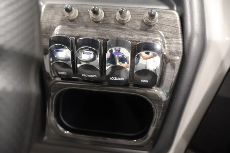 Slide: The Image of Control panel of 2026 Bentley Pontoons 223 ELITE SWINGBACK DUAL CAPTAIN with labeled switches. - 39