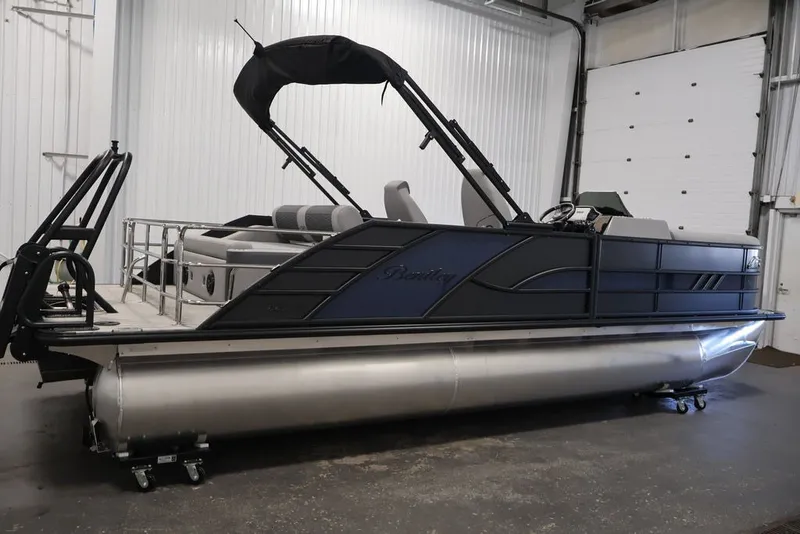 Slide: The Image of 2026 Bentley Pontoons 223 Elite Swingback Dual Captain in a showroom setting. - 10