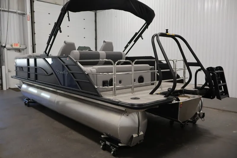 Slide: The Image of 2026 Bentley Pontoons 223 ELITE SWINGBACK DUAL CAPTAIN in a showroom, side view. - 32