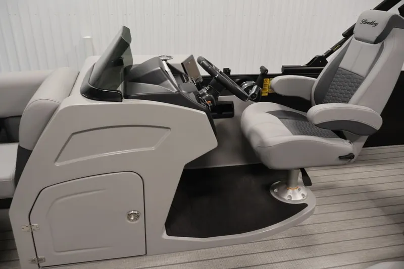 Slide: The Image of 2026 Bentley Pontoons 223 Elite Swingback Dual Captain helm with modern design and comfortable seating. - 18