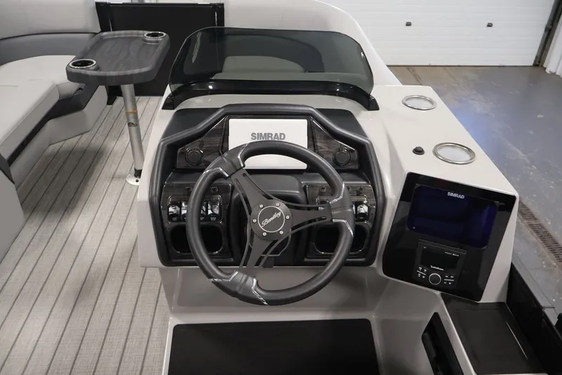 Slide: The Image of 2026 Bentley Pontoons 223 Elite Swingback Dual Captain helm with Simrad electronics and modern controls. - 24