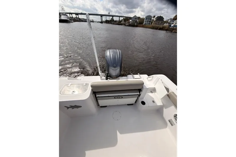Slide: The Image of 2022 Sportsman Open 242 Center Console boat on water, rear view with motor. - 11