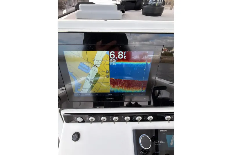 Slide: The Image of 2022 Sportsman Open 242 Center Console with Garmin navigation display. - 19