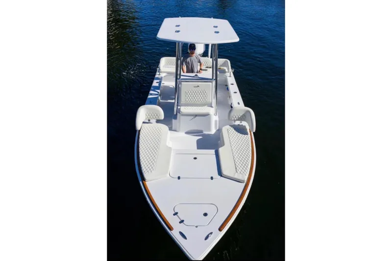 Slide: The Image of 2024 Billfish 24 boat on water, featuring sleek design and spacious seating. - 4