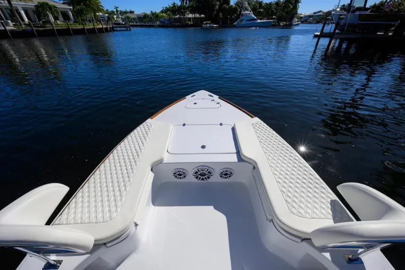 Slide: The Image of Bow view of 2024 Billfish 24 boat with luxurious seating on calm water. - 5