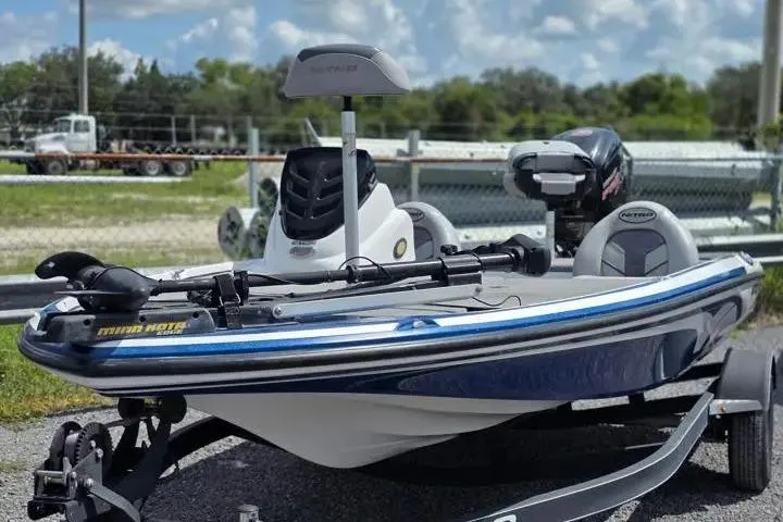 Slide: The Image of 2017 Nitro Z17 fishing boat with trailer, featuring a sleek design and powerful motor. - 2