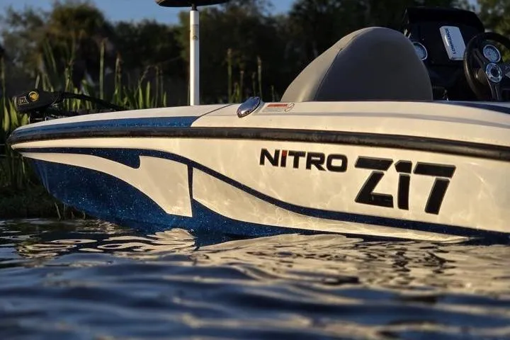 Slide: The Image of 2017 Nitro Z17 boat on water, showcasing sleek design and branding. - 23