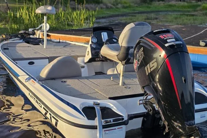 Slide: The Image of 2017 Nitro Z17 boat with Mercury 115 engine on calm water. - 25