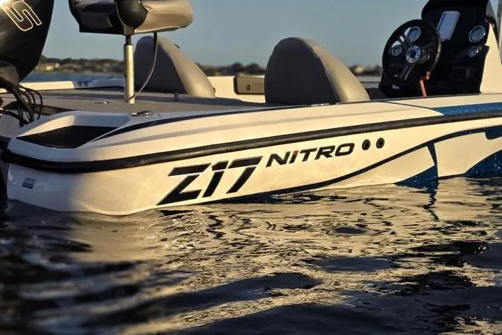 Slide: The Image of 2017 Nitro Z17 boat on water, showcasing sleek design and branding. - 31
