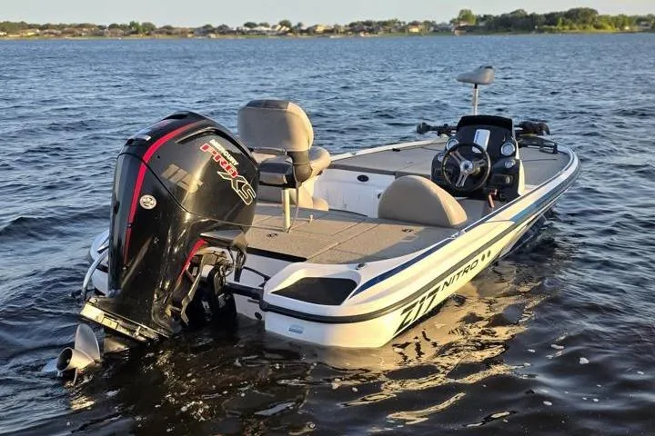 Slide: The Image of 2017 Nitro Z17 boat on water, featuring a powerful outboard motor. - 32