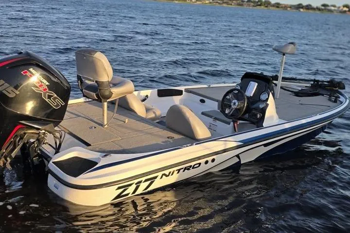 Slide: The Image of 2017 Nitro Z17 boat on water, featuring sleek design and powerful engine. - 33