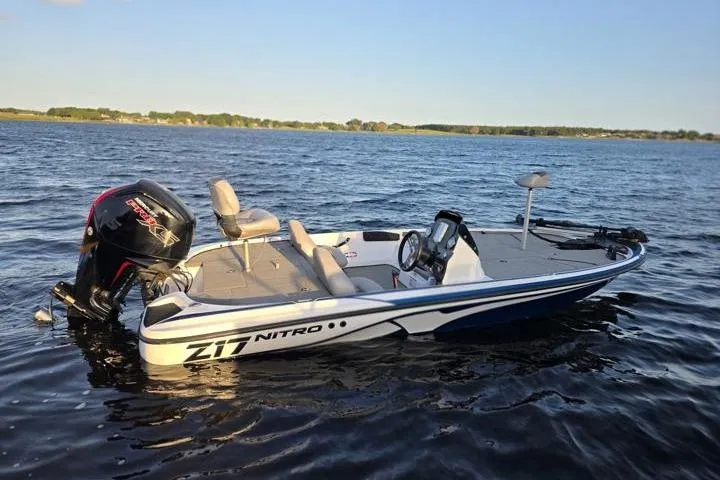 Slide: The Image of 2017 Nitro Z17 boat on a lake, featuring sleek design and powerful engine. - 34