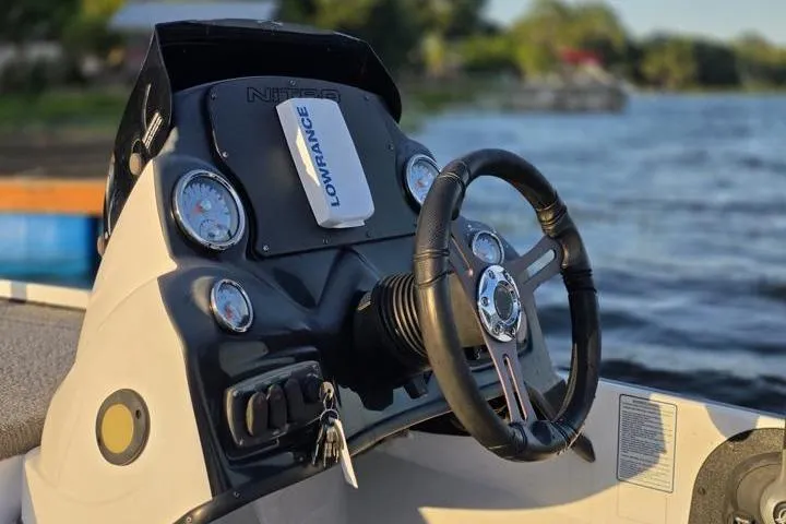 Slide: The Image of Steering console of a 2017 Nitro Z17 boat with Lowrance electronics on a lake. - 37