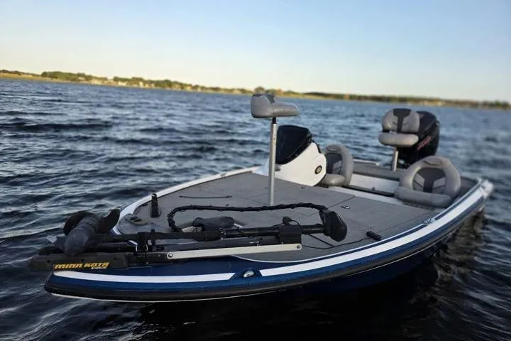Slide: The Image of 2017 Nitro Z17 boat on a calm lake, featuring fishing seats and equipment. - 39