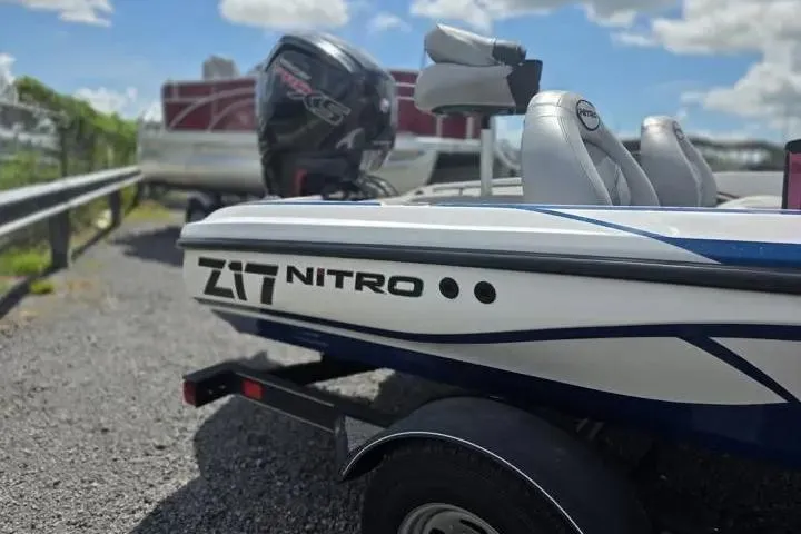 Slide: The Image of 2017 Nitro Z17 boat on trailer, featuring sleek design and powerful engine. - 9