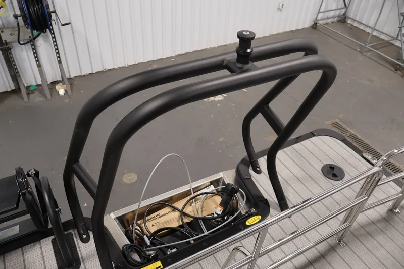 Slide: The Image of 2026 Bentley Pontoons 253 Swingback Dual Captain Elite Tri-Toon deck with railing and storage compartment. - 36