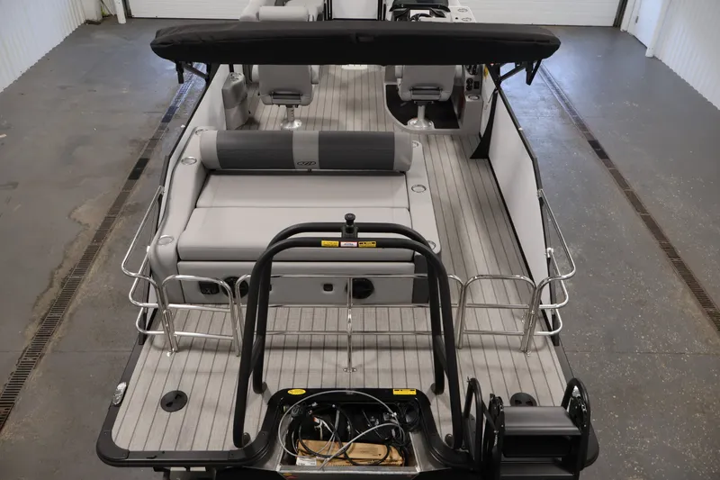 Slide: The Image of 2026 Bentley Pontoons 253 Swingback Dual Captain Elite Tri-Toon interior with sleek seating and helm. - 9