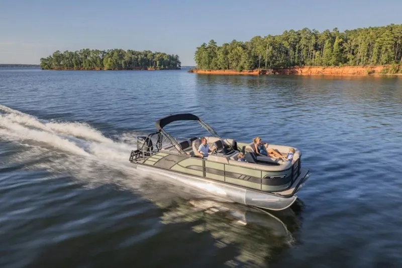 Slide: The Image of 2026 Bentley Pontoons 253 Swingback Dual Captain Elite Tri-Toon cruising on a serene lake. - 4