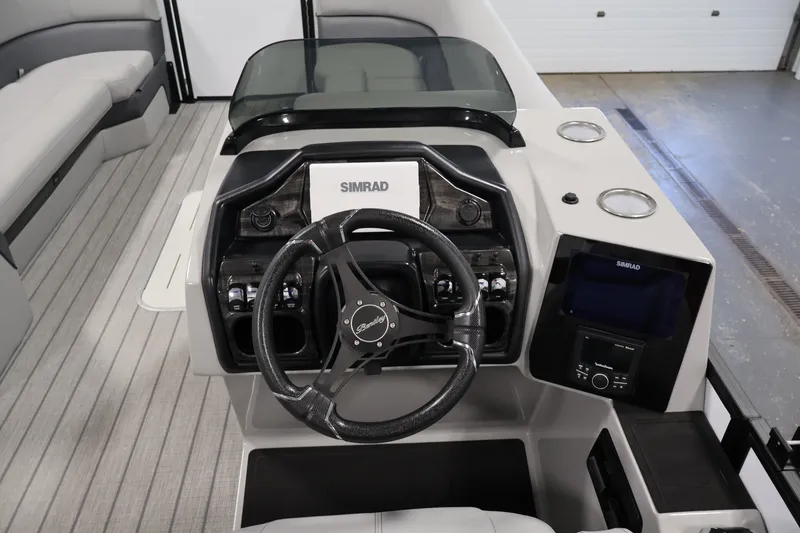 Slide: The Image of 2026 Bentley Pontoons 253 Swingback Dual Captain Elite Tri-Toon helm with Simrad electronics. - 20