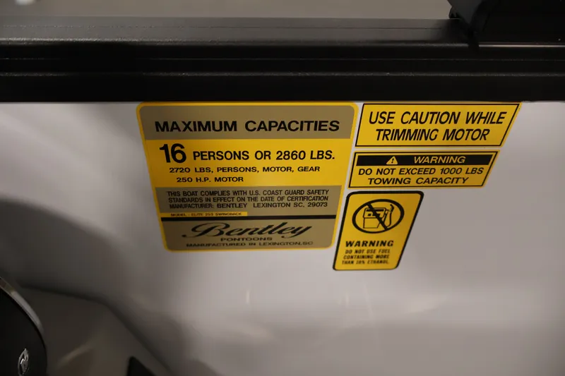Slide: The Image of 2026 Bentley Pontoons 253 Swingback capacity label, 16 persons or 2860 lbs, safety warnings. - 27